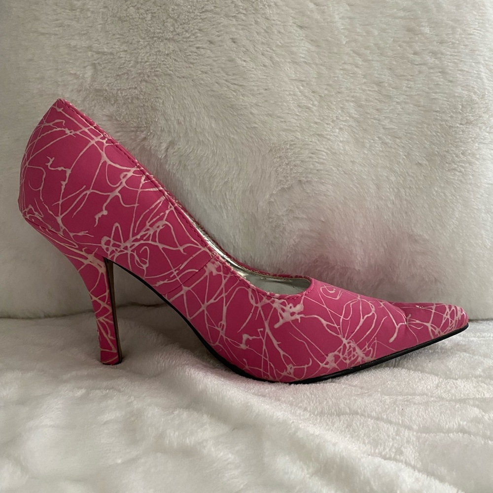 Make a statement wearing these fun and sexy pink and white heels.